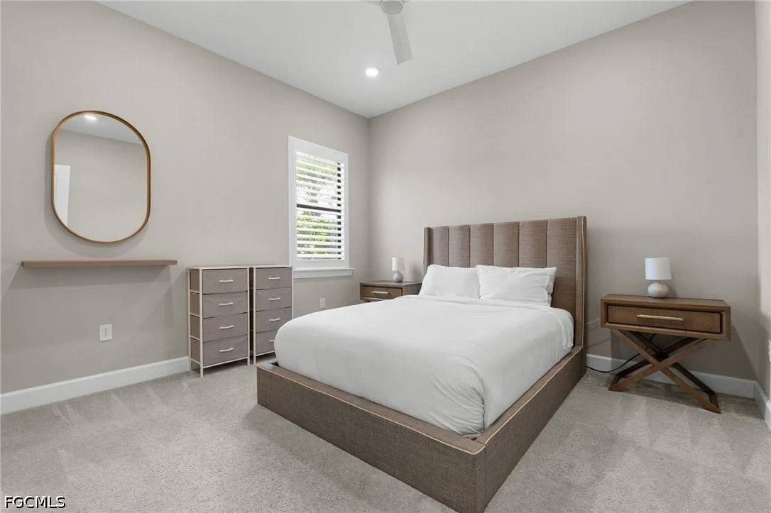 Guest bedroom in a The Place at Corkscrew home in Estero, Florida